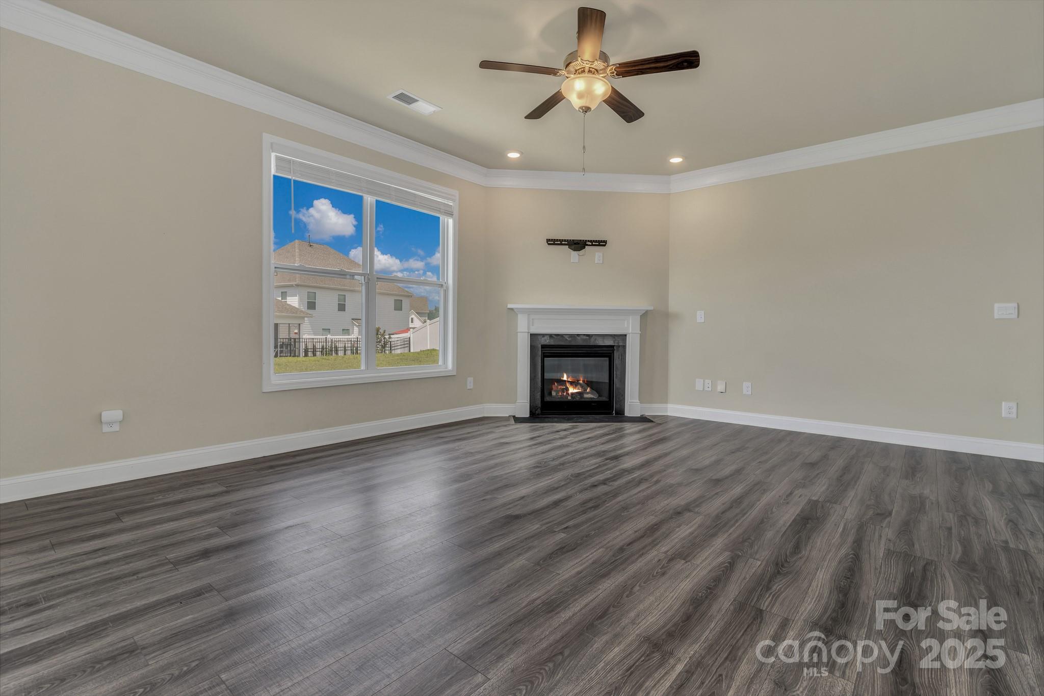 59 Thornberry Road Hendersonville, NC 28792 - Photo 11 of 48 wooden floor in an empty room with a fireplace