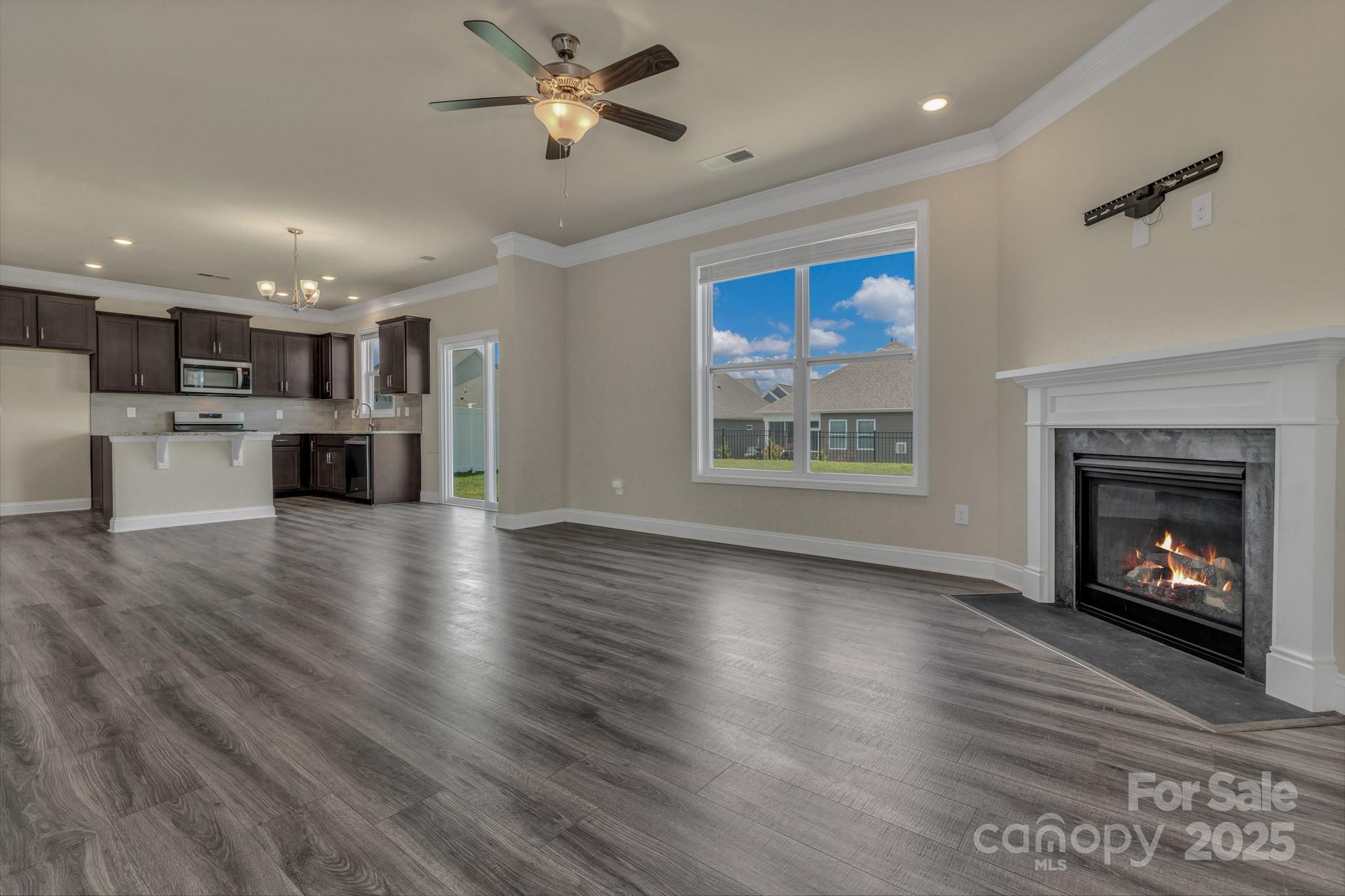 59 Thornberry Road Hendersonville, NC 28792 - Photo 13 of 48 a living room with stainless steel appliances furniture a fireplace and wooden floor