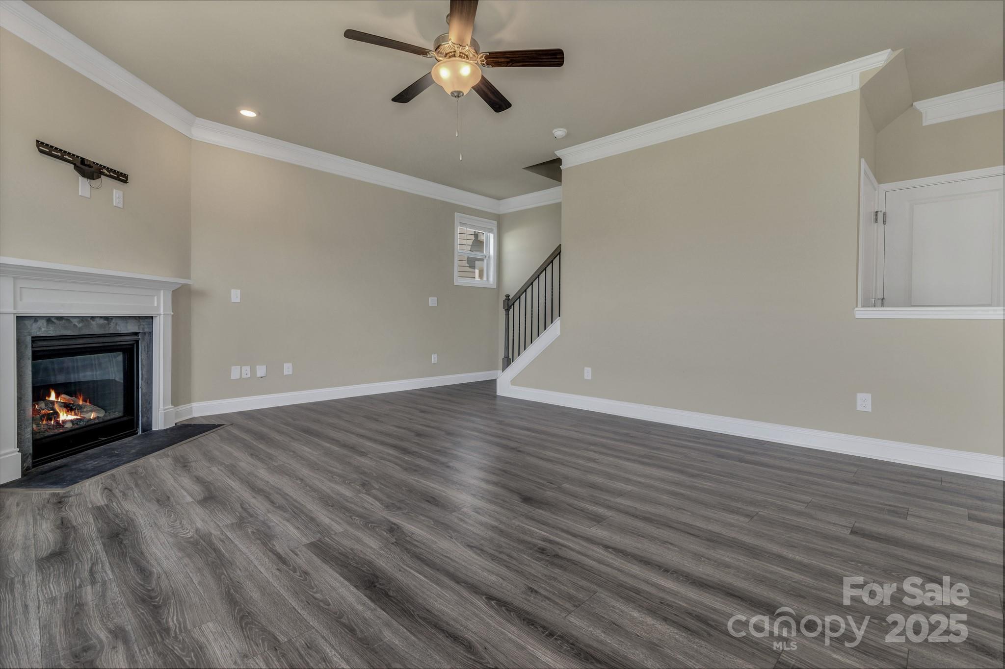 59 Thornberry Road Hendersonville, NC 28792 - Photo 14 of 48 a view of an empty room with wooden floor fireplace and a window