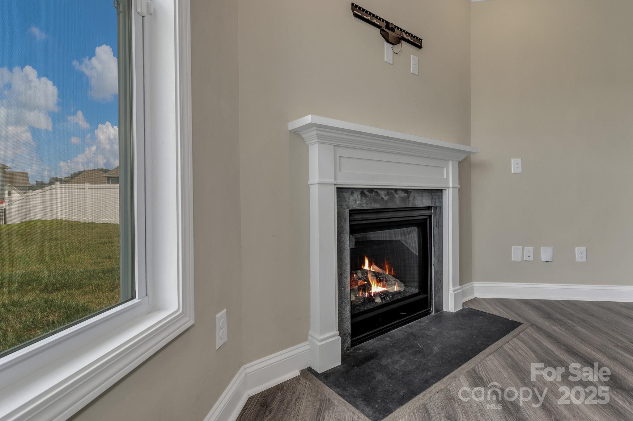 59 Thornberry Road Hendersonville, NC 28792 - Photo 15 of 48 a living room with a fireplace