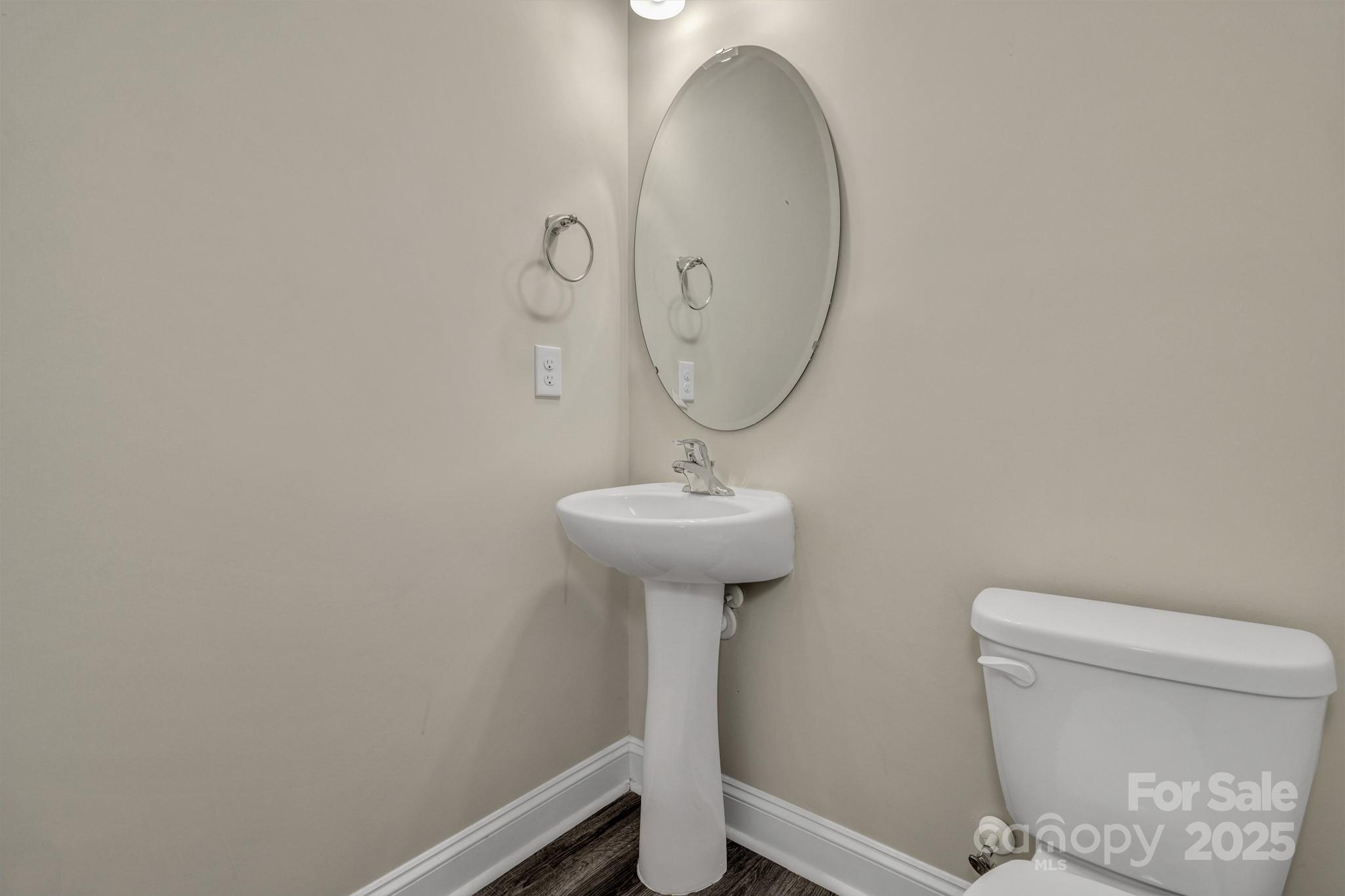 59 Thornberry Road Hendersonville, NC 28792 - Photo 24 of 48 a bathroom with a toilet a sink and a mirror