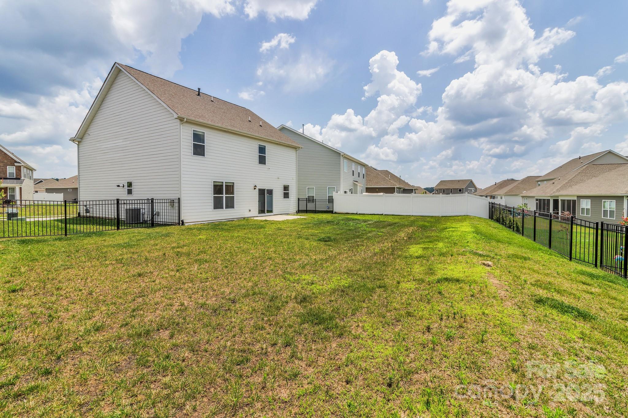 59 Thornberry Road Hendersonville, NC 28792 - Photo 47 of 48 a view of an house with backyard space and balcony