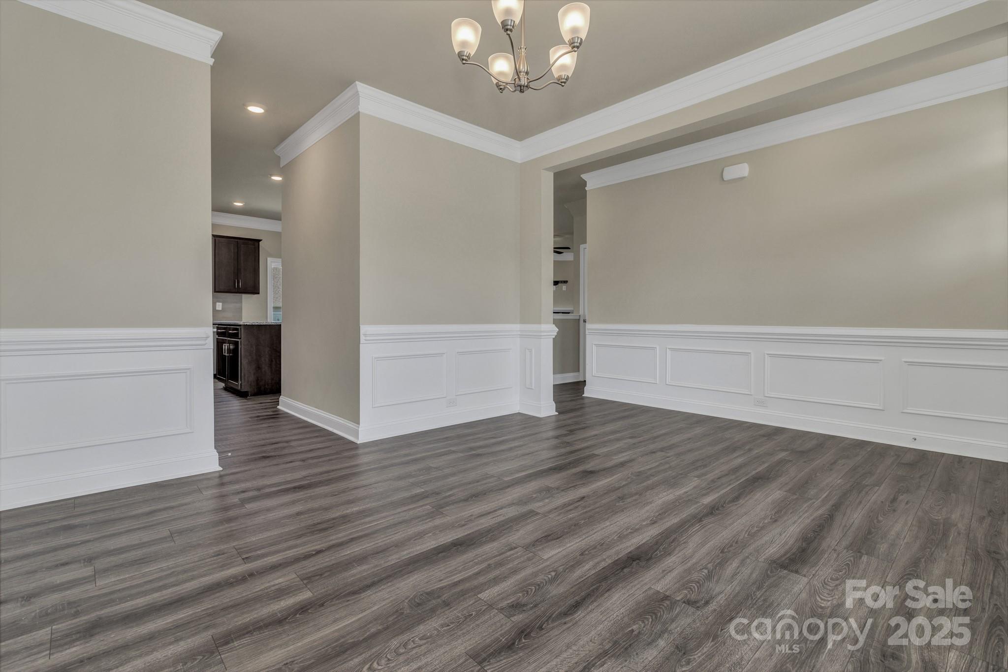 59 Thornberry Road Hendersonville, NC 28792 - Photo 6 of 48 a view of an empty room with wooden floor and a window