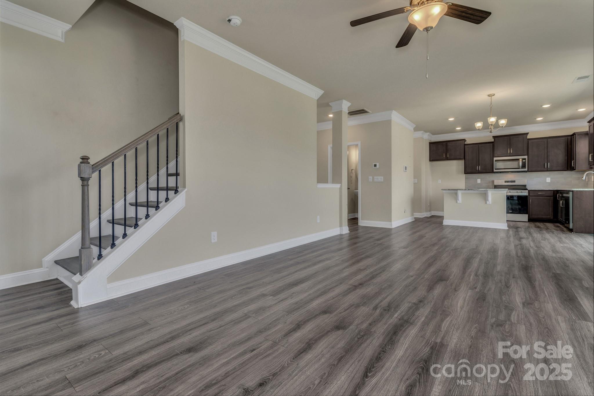 59 Thornberry Road Hendersonville, NC 28792 - Photo 10 of 48 a view of a hallway with wooden floor and a kitchen