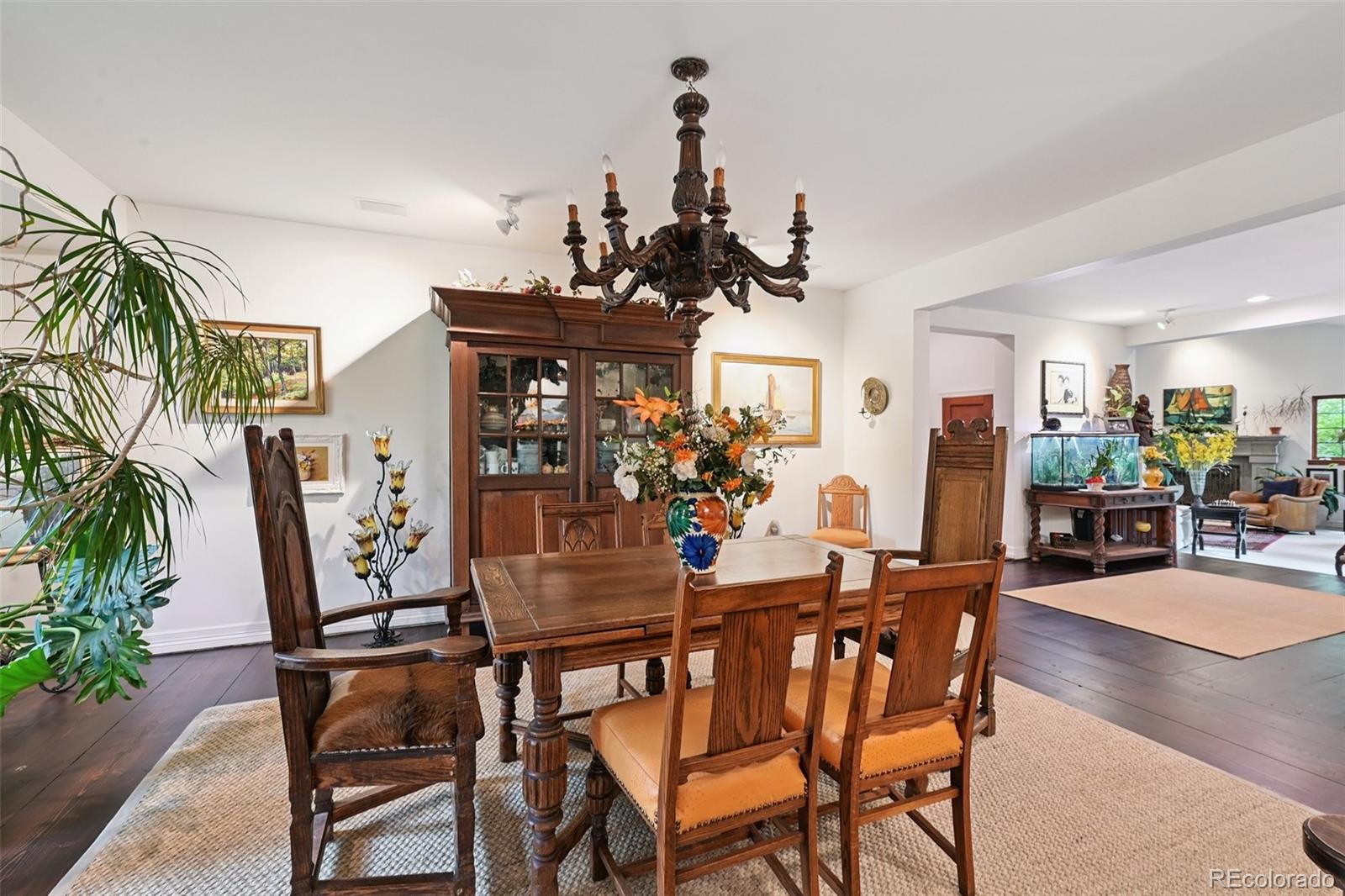3391 Oak Street Wheat Ridge, CO 80033 - Photo 16 of 50 a dining room with furniture and wooden floor