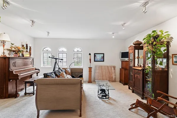 a bedroom with a bed and a couch