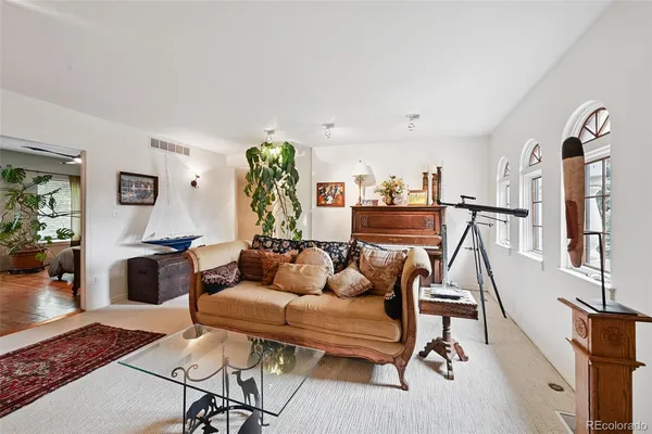 a view of a livingroom with furniture and toys
