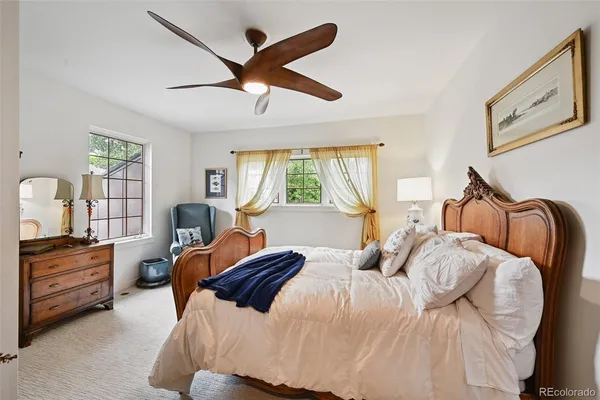 a room with furniture a mirror and wooden floor
