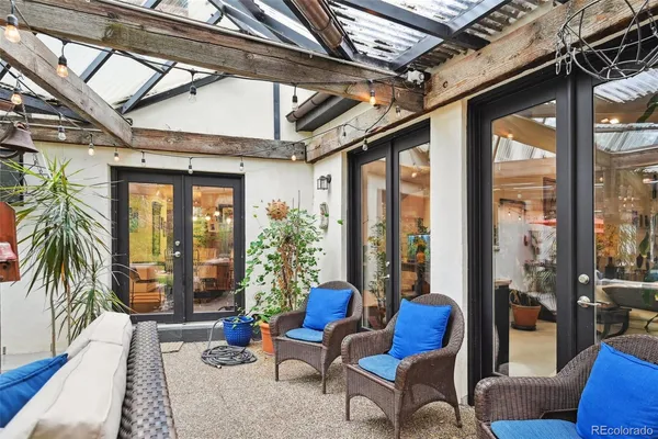 a view of a house with a yard and sitting area