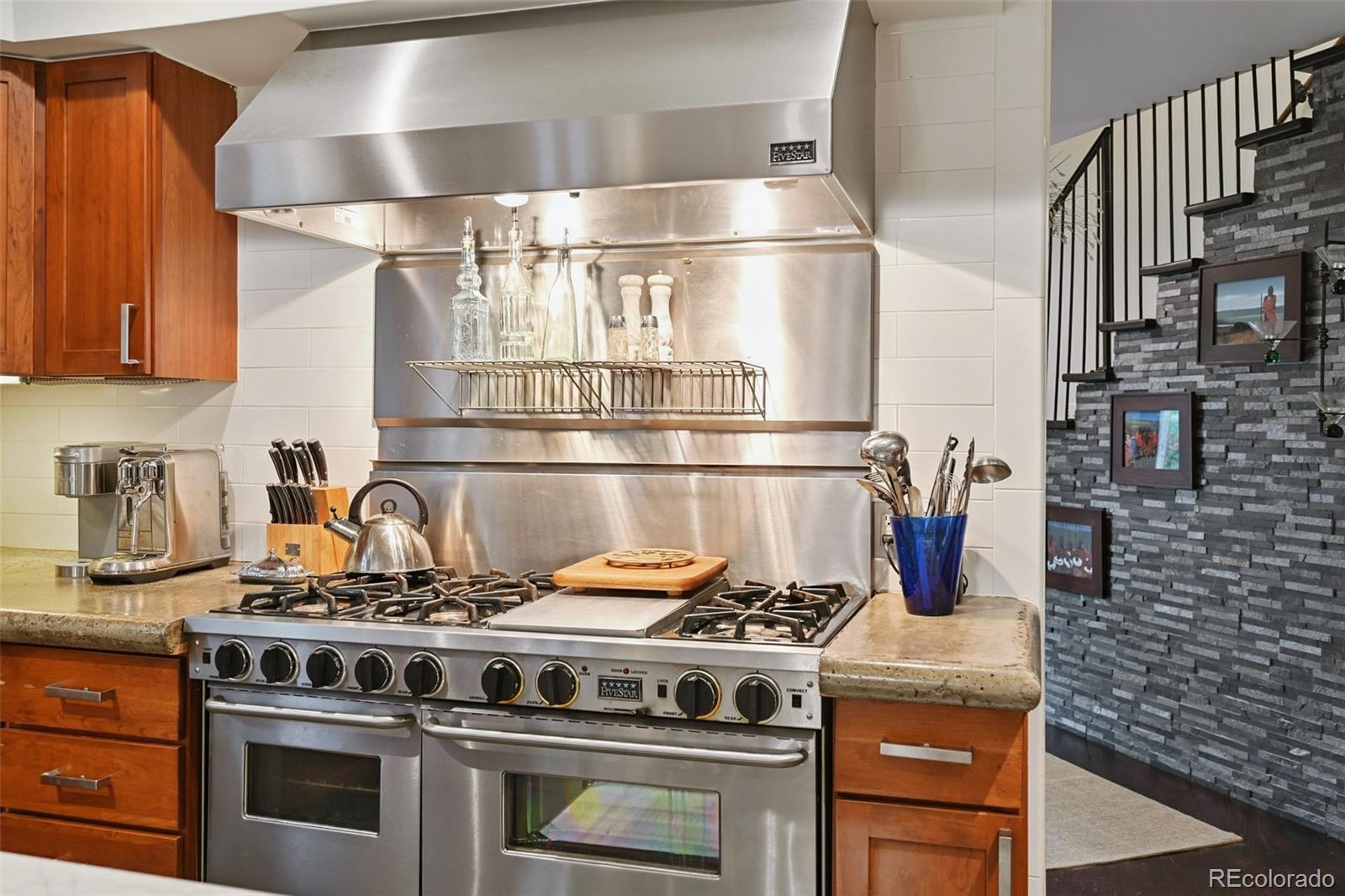 3391 Oak Street Wheat Ridge, CO 80033 - Photo 4 of 50 a stove top oven sitting inside of a kitchen