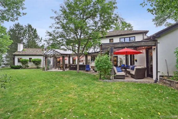 an aerial view of a house with garden space and street view