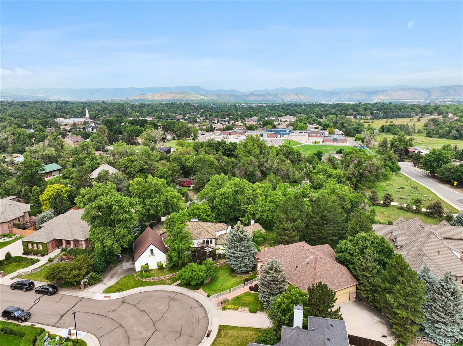 3391 Oak Street Wheat Ridge, CO 80033 - Photo 45 of 50 an aerial view of residential houses with outdoor space and trees
