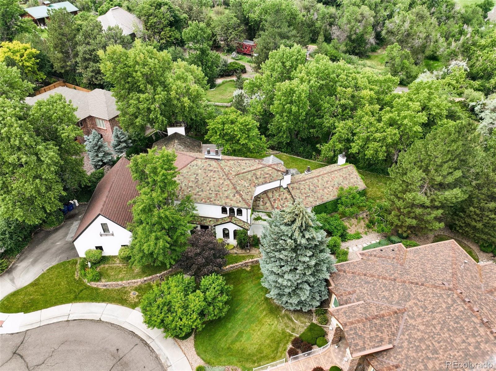 3391 Oak Street Wheat Ridge, CO 80033 - Photo 49 of 50 an aerial view of a house with yard and green space