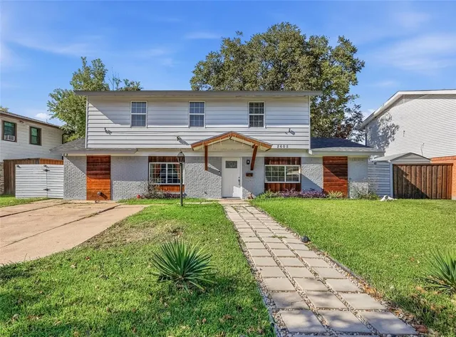 front view of a house with a yard