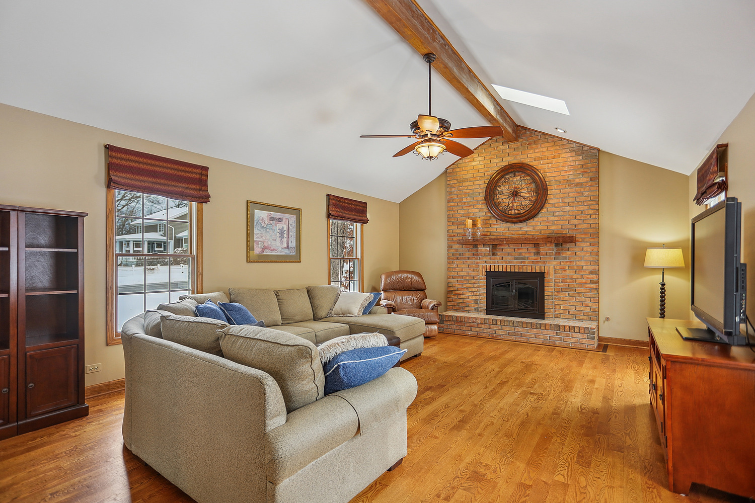 580 Moray Terrace Crete, IL 60417 - Photo 8 of 35 a living room with furniture a fireplace and a flat screen tv