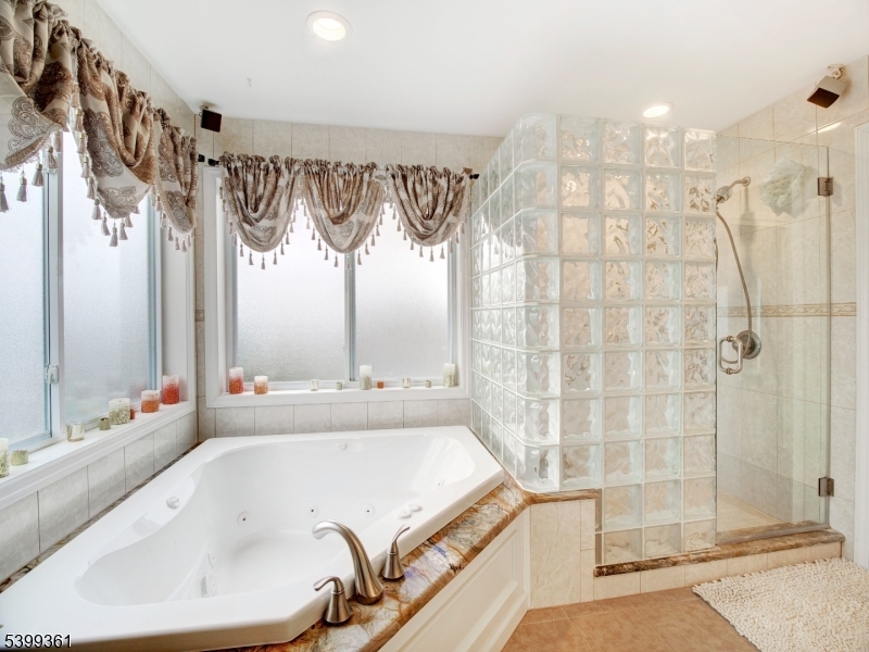 2 Papakating Road Hopatcong, NJ 07843 - Photo 18 of 28 a bathroom with a bathtub and a shower