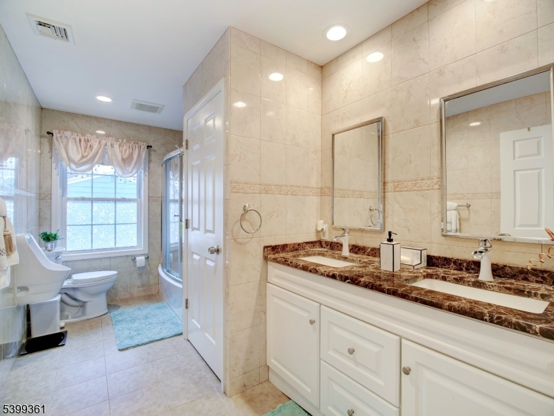 2 Papakating Road Hopatcong, NJ 07843 - Photo 21 of 28 a spacious bathroom with double sink and a large mirror