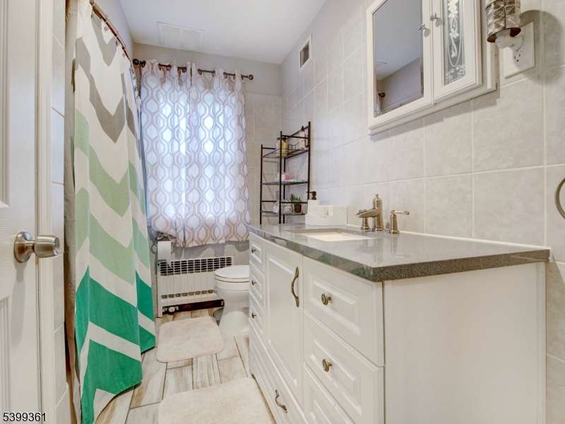 2 Papakating Road Hopatcong, NJ 07843 - Photo 9 of 28 a bathroom with a sink and a mirror