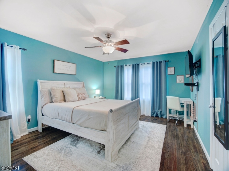 2 Papakating Road Hopatcong, NJ 07843 - Photo 10 of 28 a spacious bedroom with a bed and a chandelier