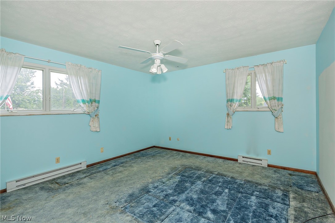 5339 East Heisley Road Mentor, OH 44060 - Photo 14 of 24 Ceiling fan. HIgh window allow for ore furniture placement options.