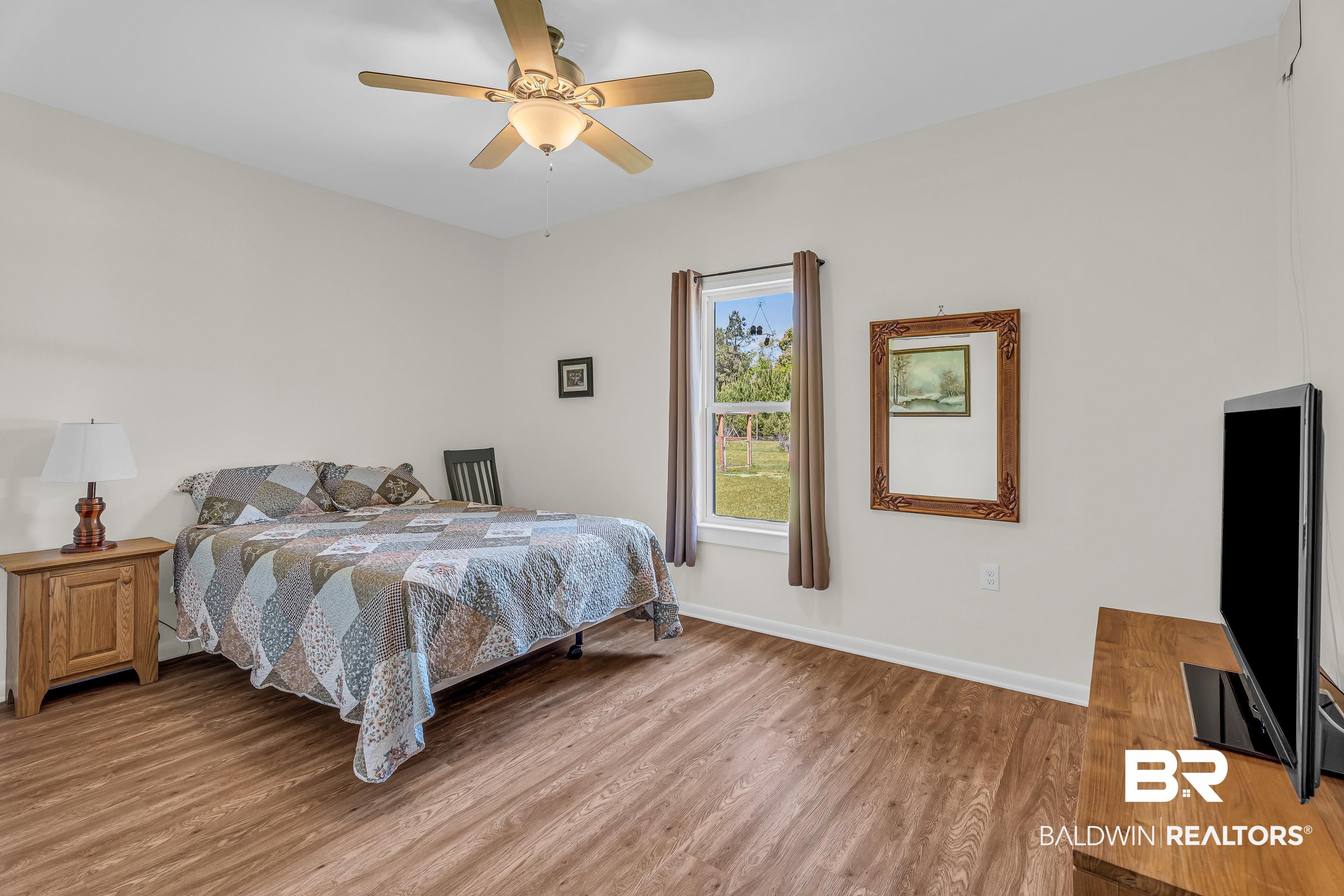 18255 Cactus Court Elberta, AL 36530 - Photo 25 of 53 Bedroom featuring wood finished floors and ceiling fan