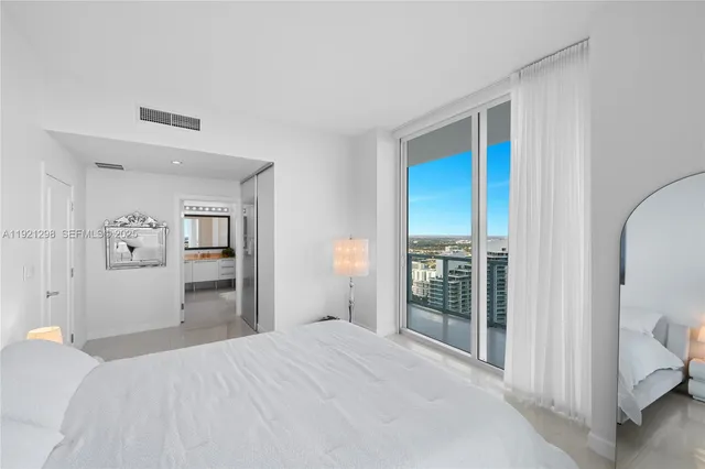 a view of a living room and a balcony