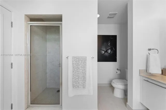 a view of a room with furniture and a potted plant