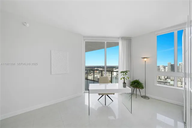 a bedroom with a bed and hallway