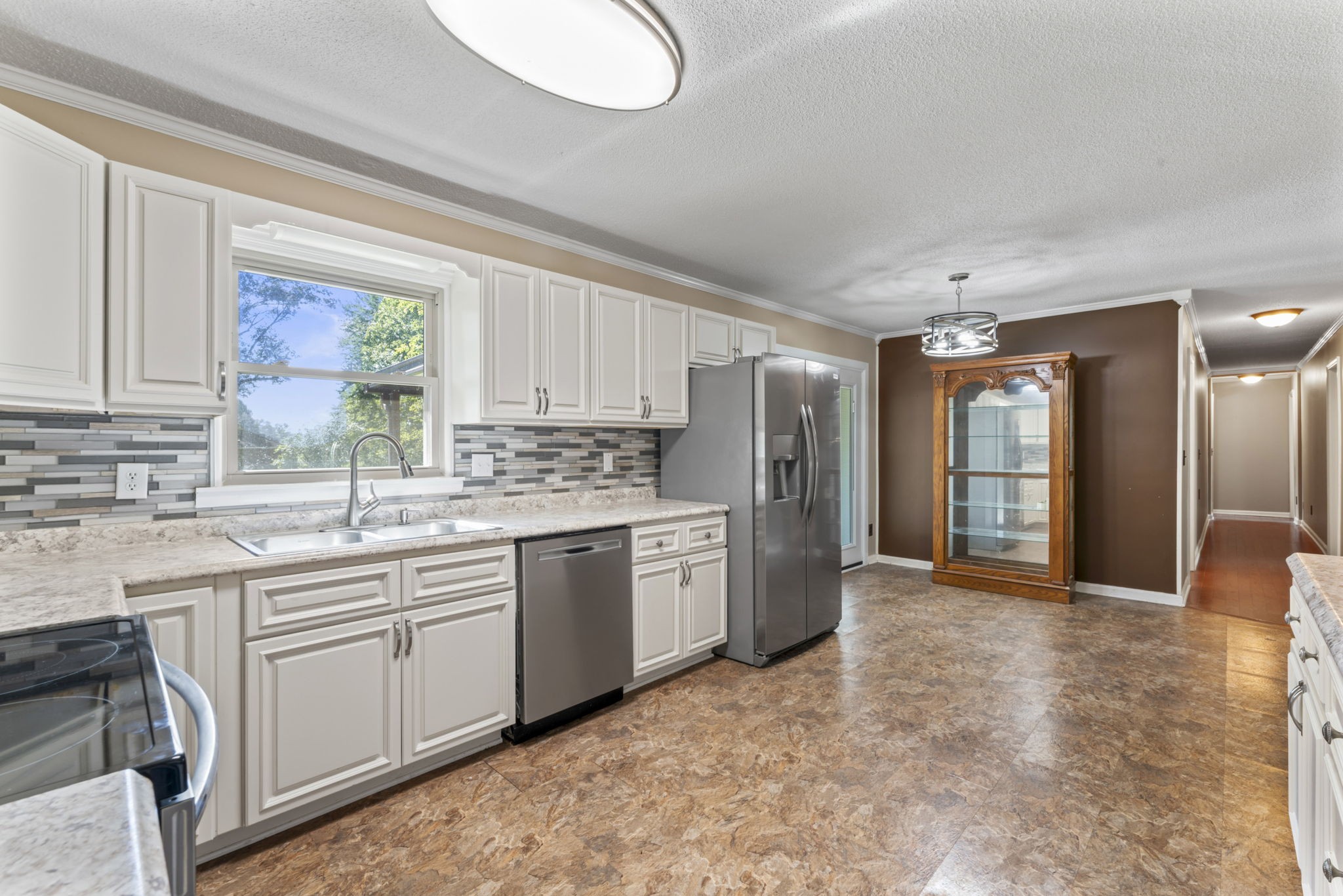 499 Ridgewood Drive Manchester, TN 37355 - Photo 11 of 37 a kitchen with a sink stove and refrigerator