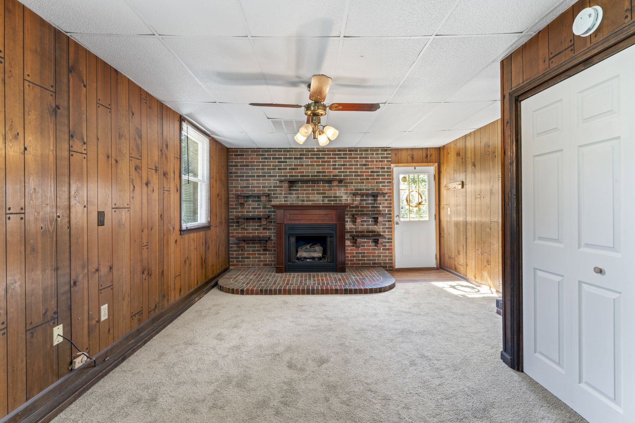 499 Ridgewood Drive Manchester, TN 37355 - Photo 15 of 37 a view of an empty room with a fireplace and a window