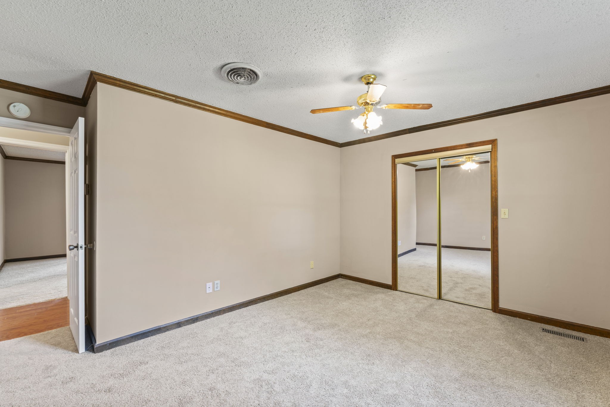 499 Ridgewood Drive Manchester, TN 37355 - Photo 19 of 37 an empty room with closet and a chandelier fan