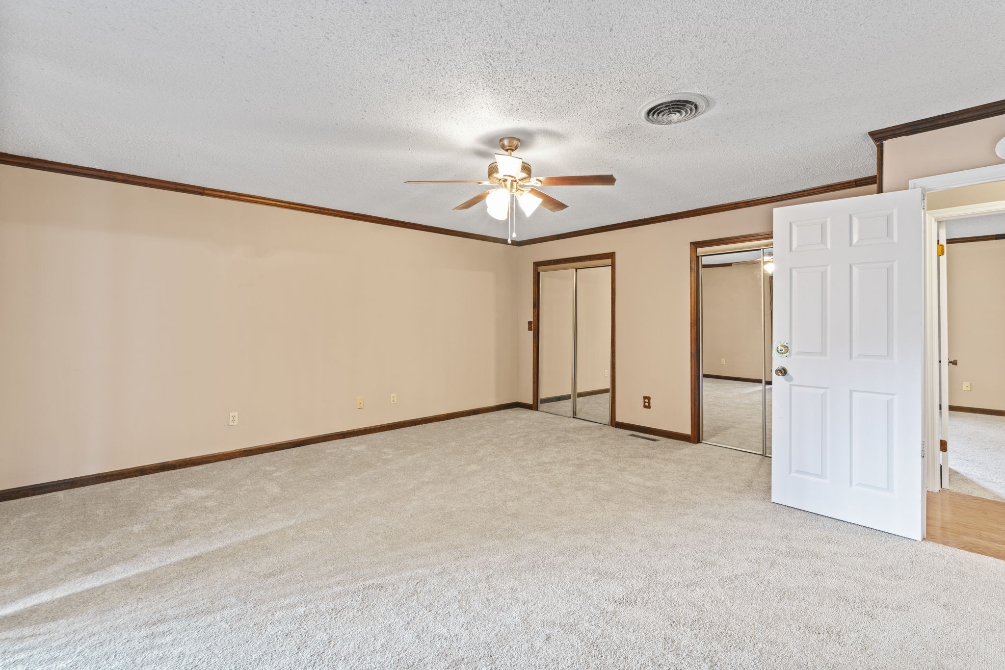 499 Ridgewood Drive Manchester, TN 37355 - Photo 21 of 37 an empty room with chandelier fan and windows