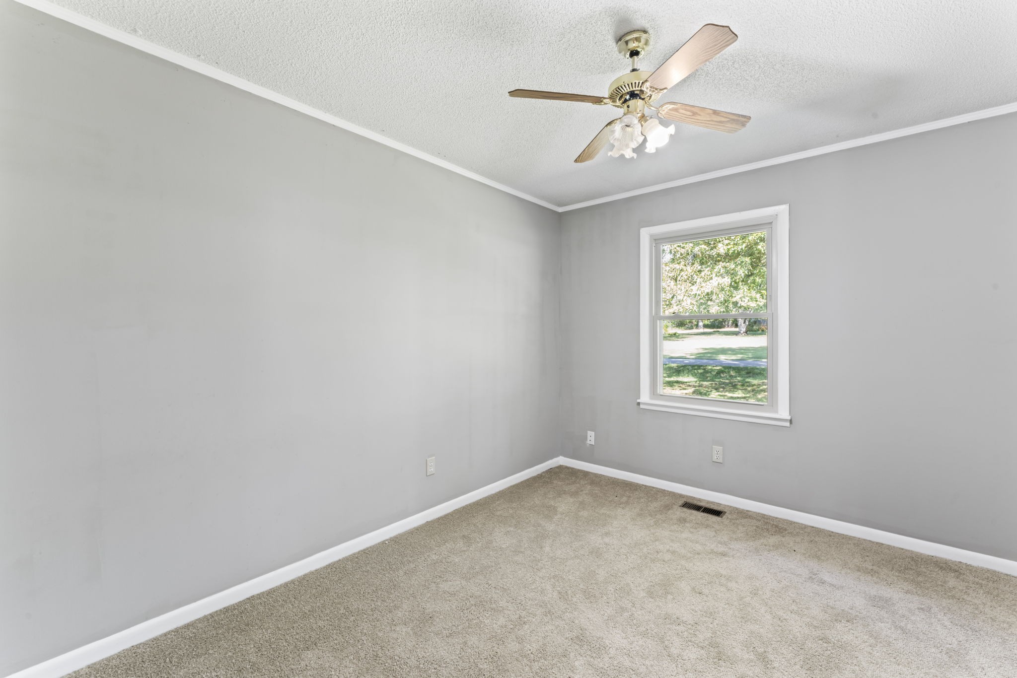 499 Ridgewood Drive Manchester, TN 37355 - Photo 25 of 37 an empty room with a window and a fan