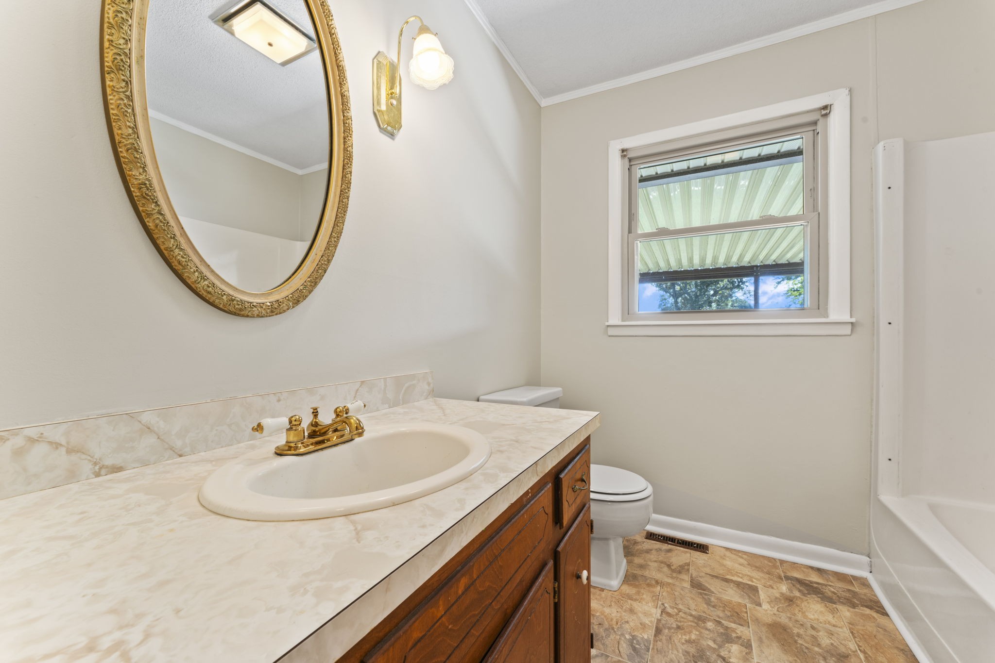 499 Ridgewood Drive Manchester, TN 37355 - Photo 27 of 37 a bathroom with a sink and a mirror