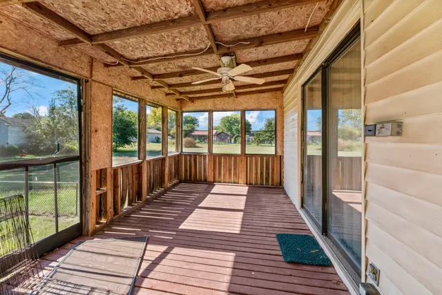 a porch with wooden floor
