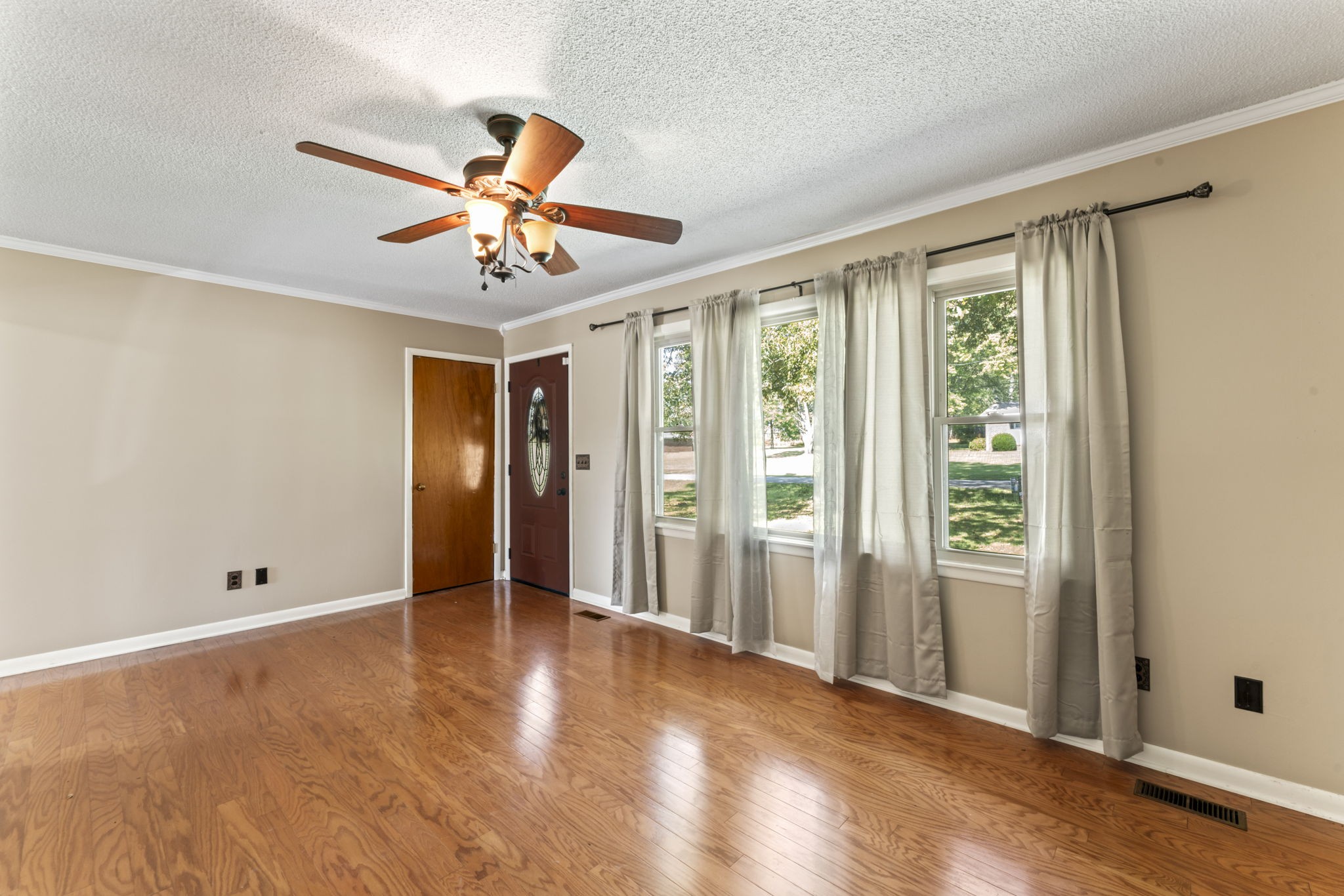 499 Ridgewood Drive Manchester, TN 37355 - Photo 7 of 37 wooden floor in an empty room with a window