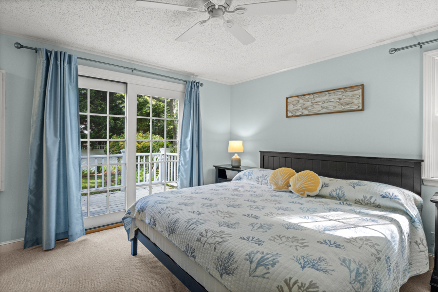112 3rd Street North Edgartown, MA 02539 - Photo 15 of 36 a bedroom with a bed and a large window