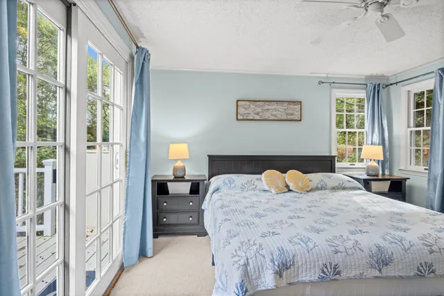 a bedroom with a large bed and a window