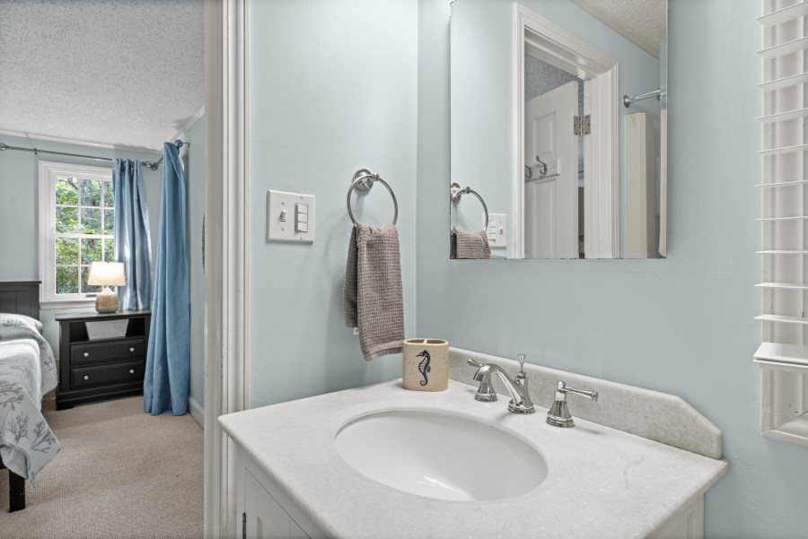 112 3rd Street North Edgartown, MA 02539 - Photo 20 of 36 a en suite bathroom with a sink and a mirror