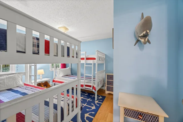 a bedroom with furniture and a book shelf
