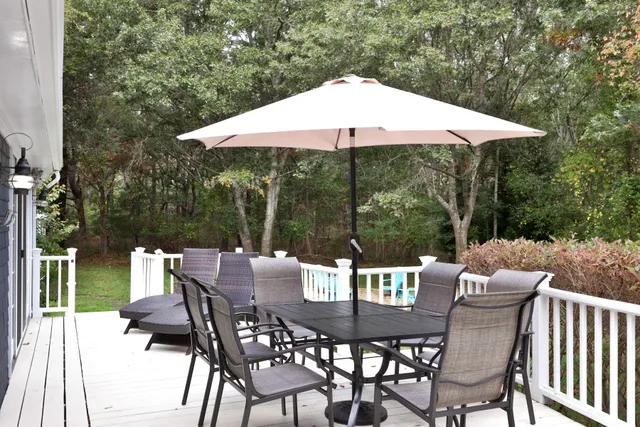 a view of an outdoor space with furniture and backyard