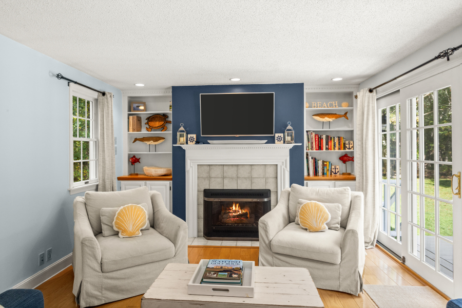 112 3rd Street North Edgartown, MA 02539 - Photo 5 of 36 a living room with furniture a flat screen tv and a fireplace