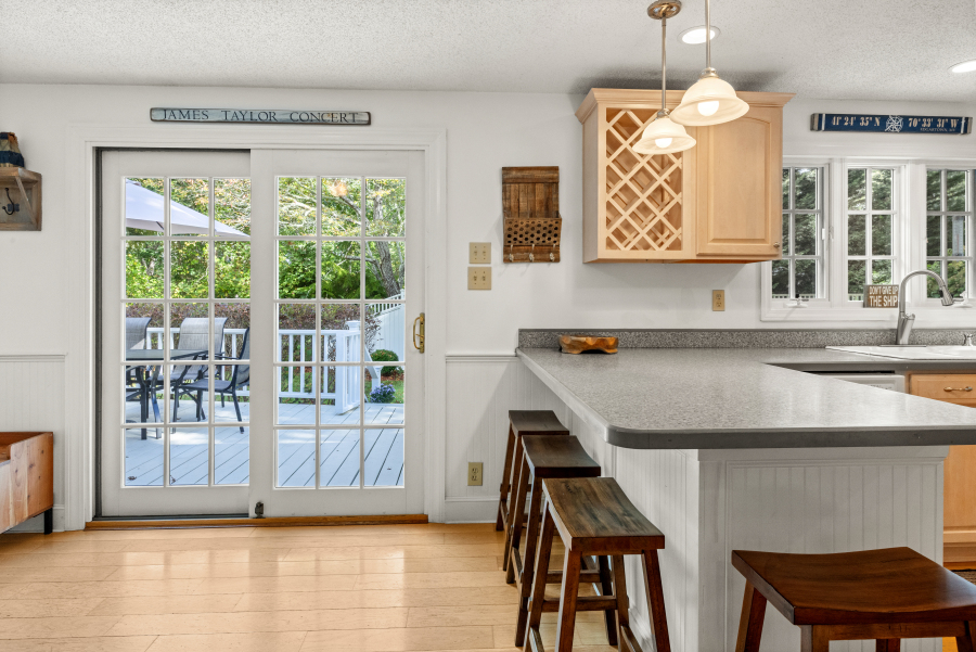 112 3rd Street North Edgartown, MA 02539 - Photo 9 of 36 a view of a kitchen with a window and wooden floor