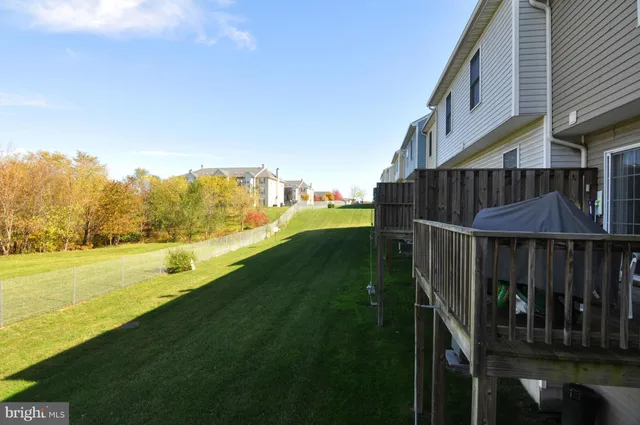 a view of a balcony with an outdoor space and seating area