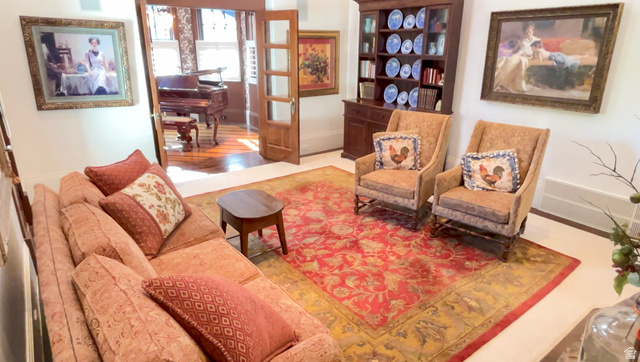 426 West Center Street Parowan, UT 84761 - Photo 33 of 107 Light-filled interior featuring hardwood flooring, a built-in display cabinet, and French doors