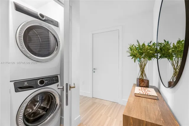 a view of a hallway with washer and dryer