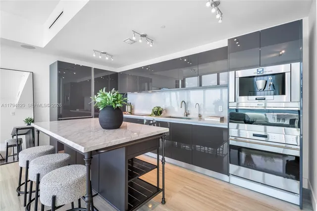 a kitchen with a table and chairs in it