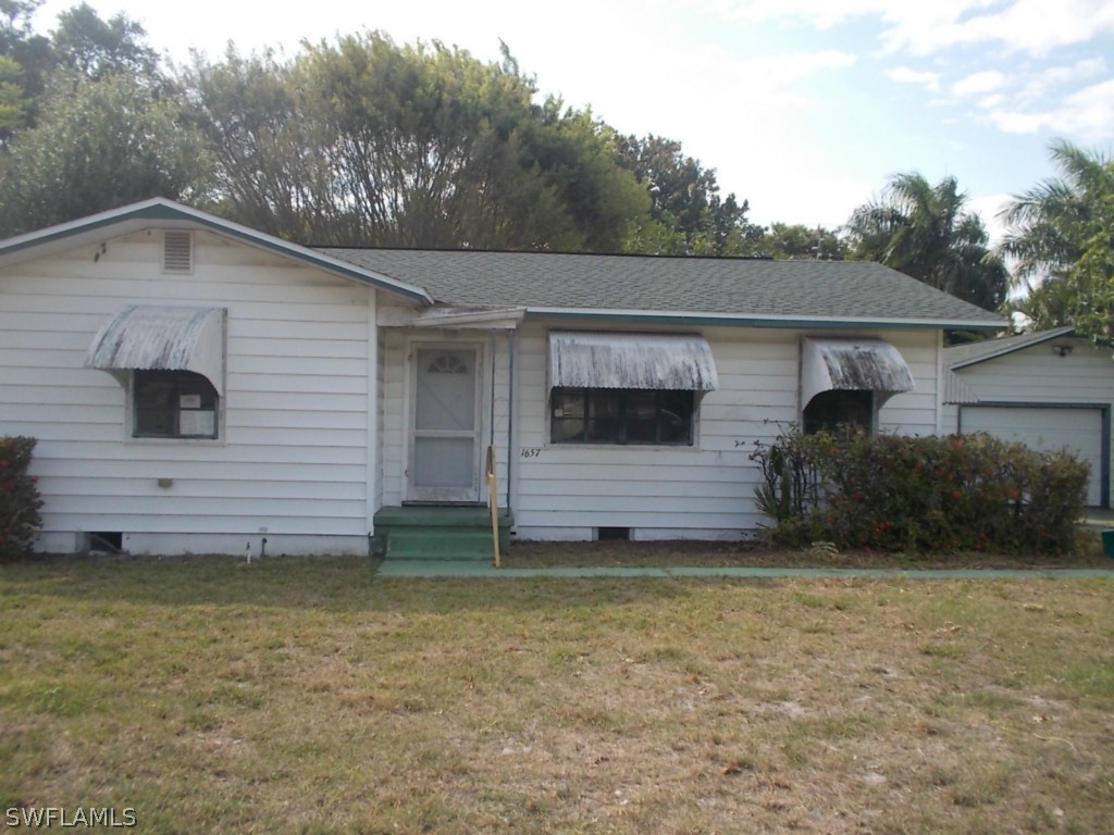 1657 Ardmore Road Fort Myers, FL 33901 - Photo 1 of 14 a view of a house with a yard