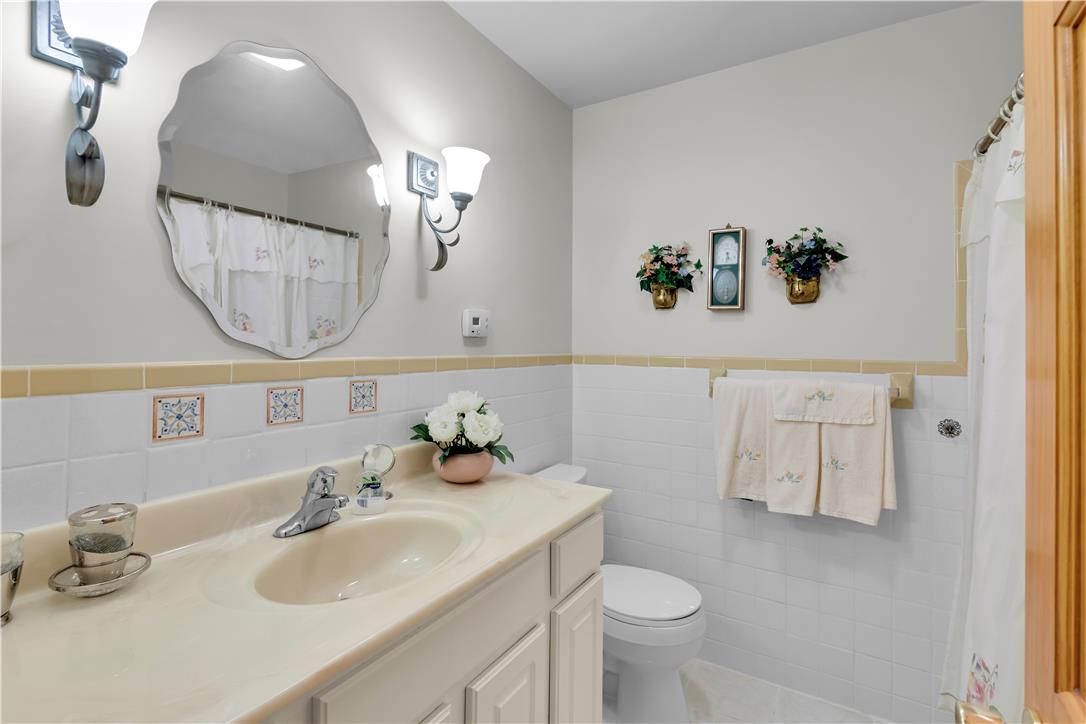 3915 Hecktown Road Bethlehem, PA 18020 - Photo 23 of 42 Classical wall tiling and a molded vanity basin define this functional bathroom space.