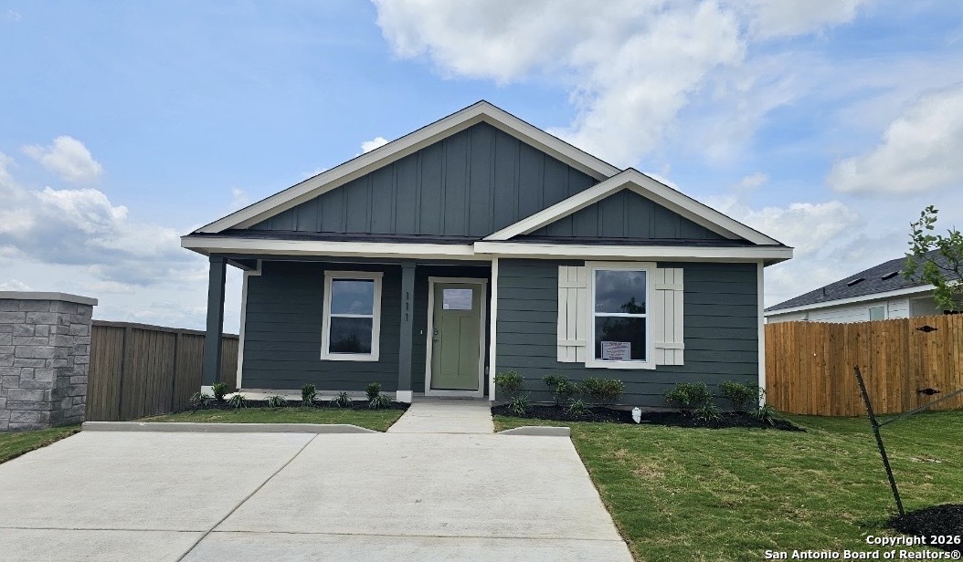a front view of a house with yard
